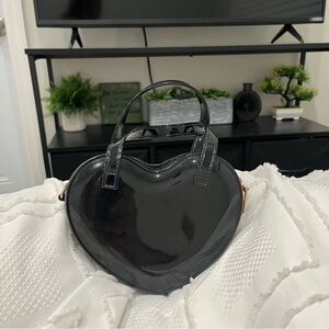 Black heart shaped purse.